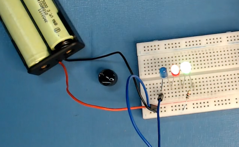 now-connect-a-wire-from-the-last-led-terminal-to-the-power-rail-and-glow-the-light